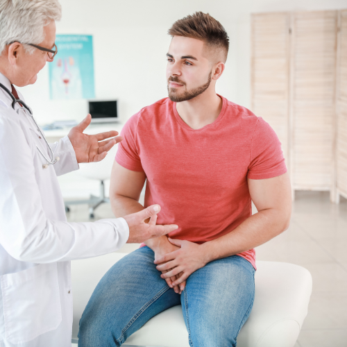 Doctor discussing with male patient in medical office
