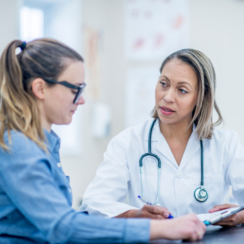 Doctor discussing with patient in clinic